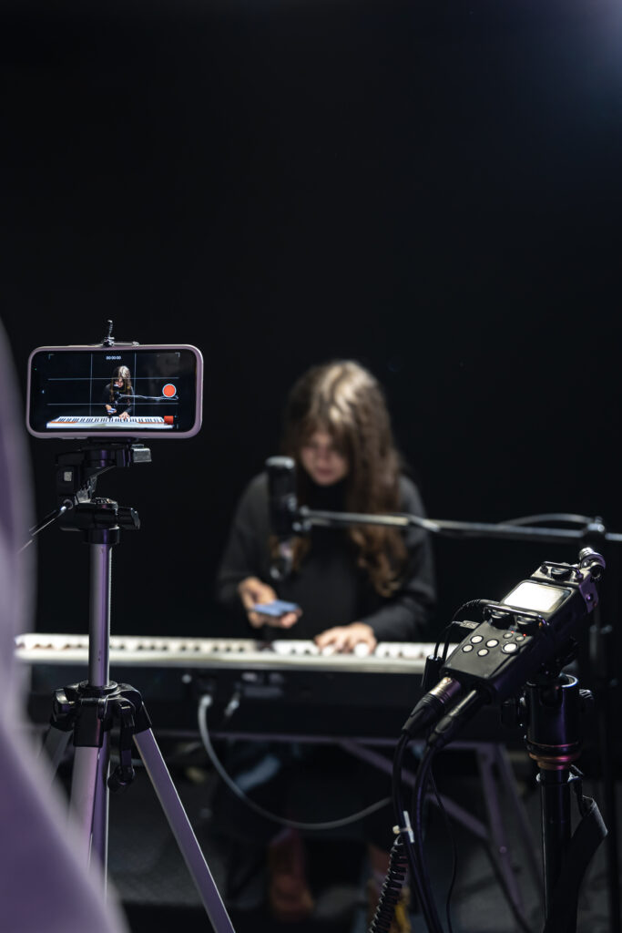 the process of recording video content for learning to play the piano.
